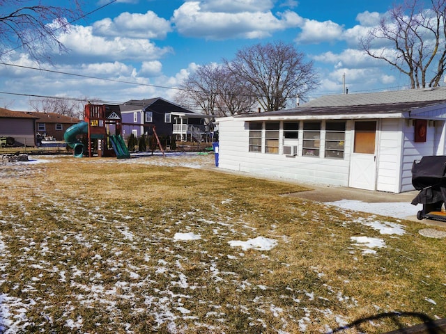 snowy yard with a playground