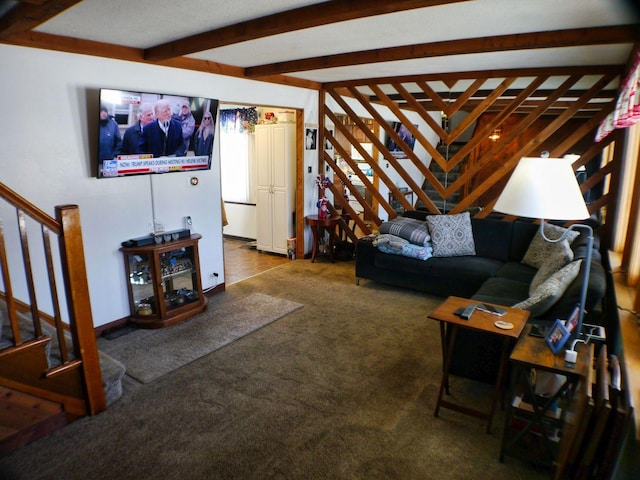 carpeted living room with beam ceiling