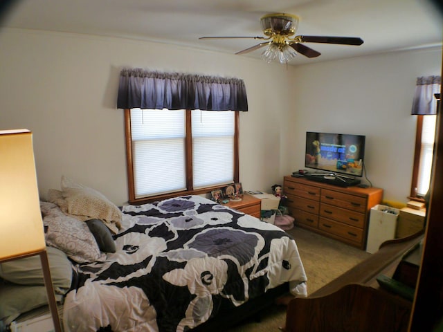 bedroom with ceiling fan and carpet