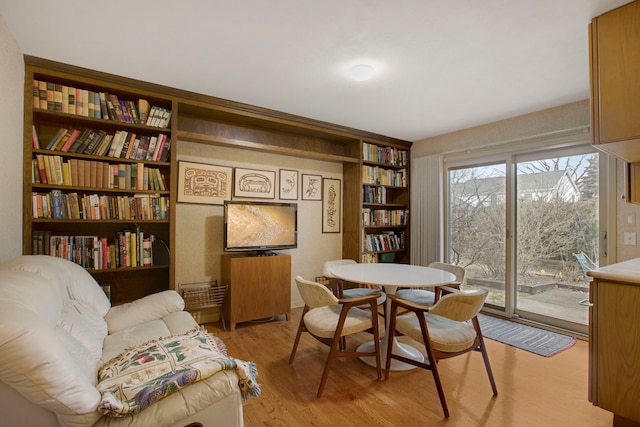 interior space with built in features and light hardwood / wood-style floors
