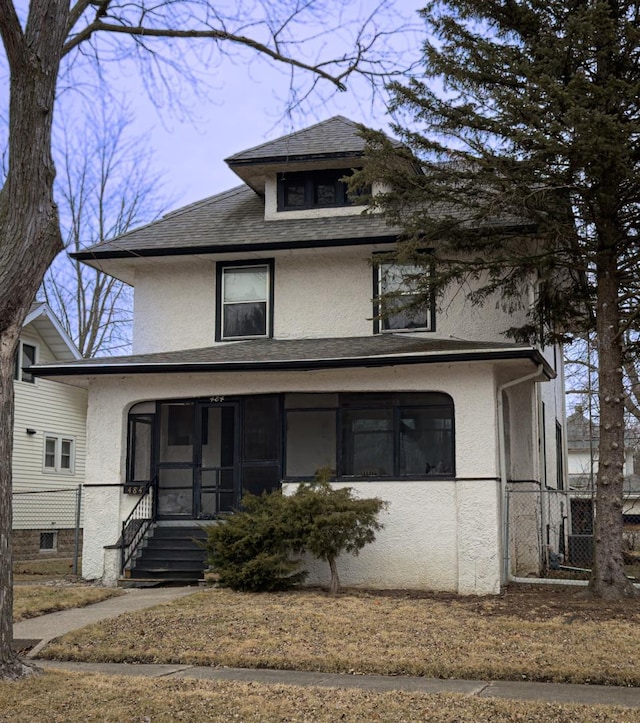 view of front property featuring a sunroom