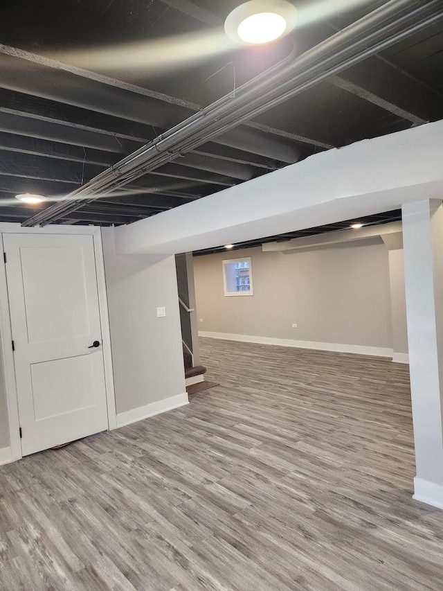 basement with wood-type flooring