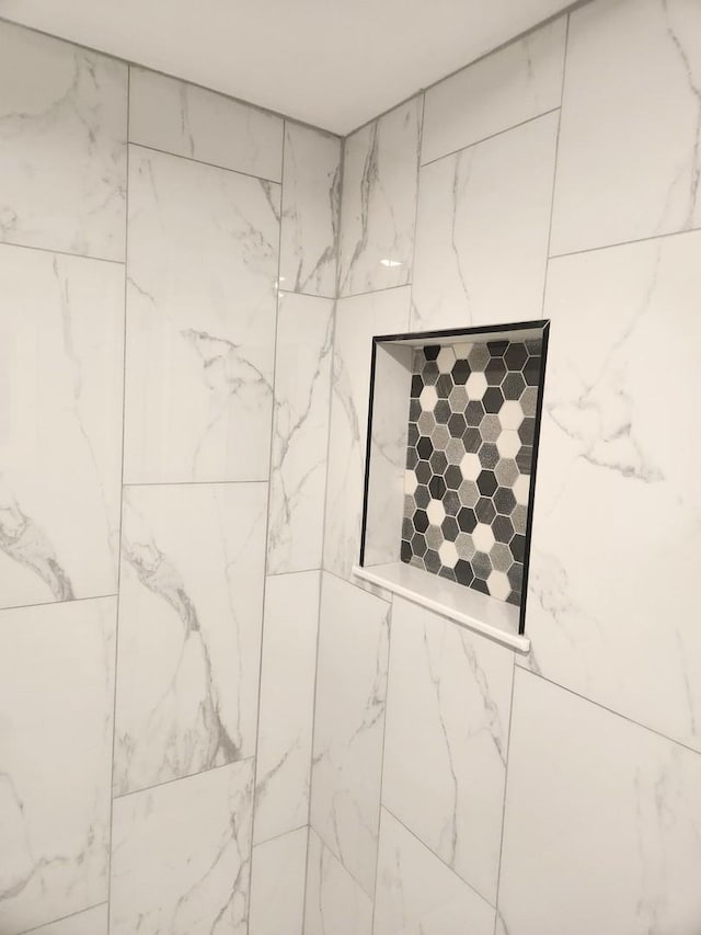 details featuring a tile shower