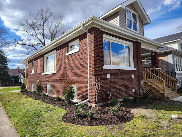 view of property exterior with a lawn