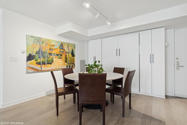 dining room with light wood-type flooring