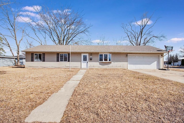 ranch-style house with driveway and an attached garage