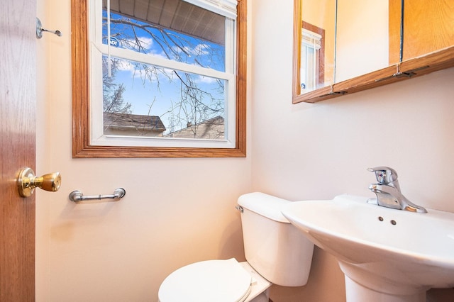 bathroom featuring a sink and toilet