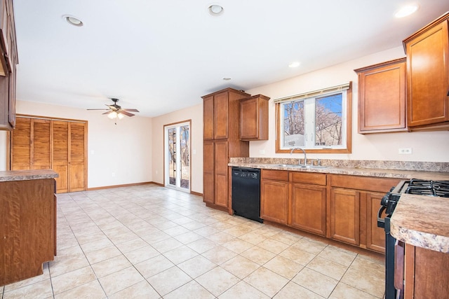 kitchen with black appliances, a sink, light countertops, and brown cabinets