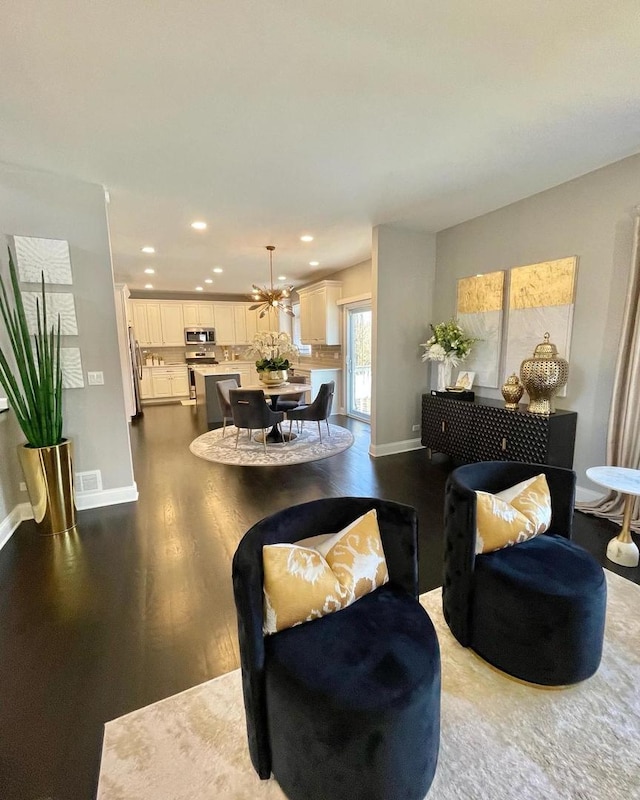 living room featuring dark hardwood / wood-style flooring