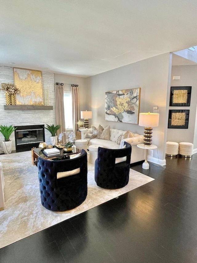 living room featuring a large fireplace