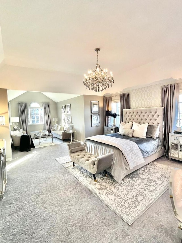 carpeted bedroom with multiple windows, lofted ceiling, and an inviting chandelier