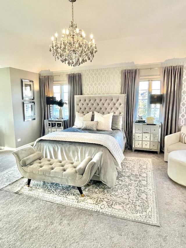 carpeted bedroom with a notable chandelier