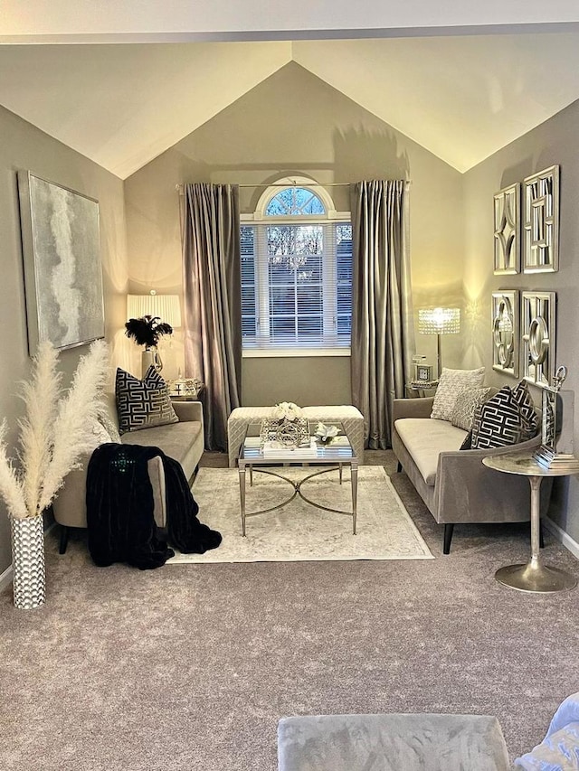 living area with vaulted ceiling and carpet