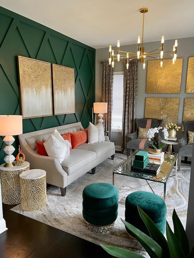 living room with hardwood / wood-style flooring and a notable chandelier