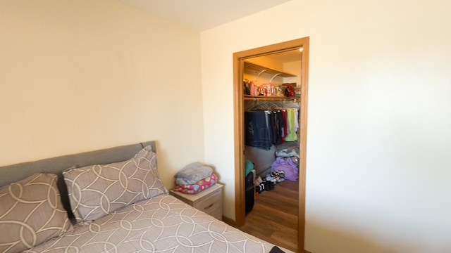 bedroom featuring wood-type flooring and a closet