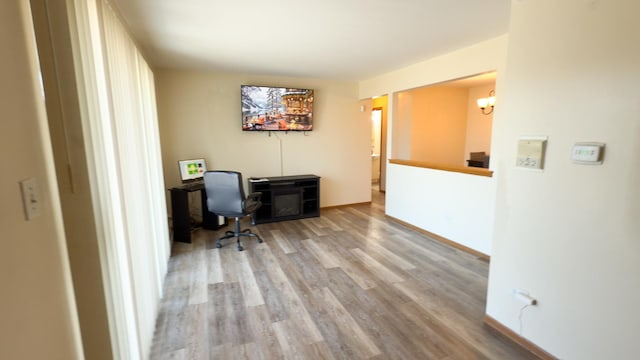 home office with light wood-type flooring