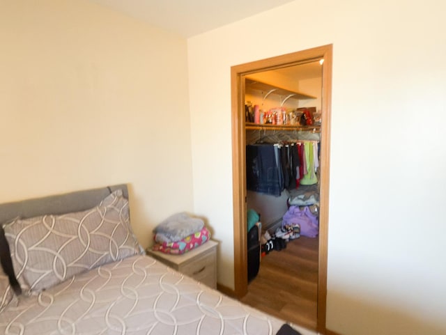 bedroom featuring wood finished floors