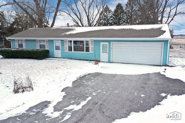 single story home featuring a garage