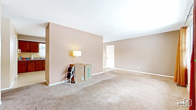 unfurnished room with light carpet