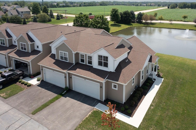 drone / aerial view featuring a water view and a rural view