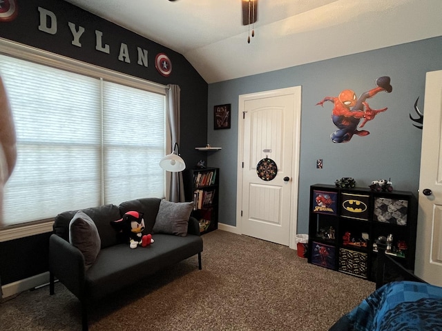 living room with dark colored carpet, vaulted ceiling, and ceiling fan