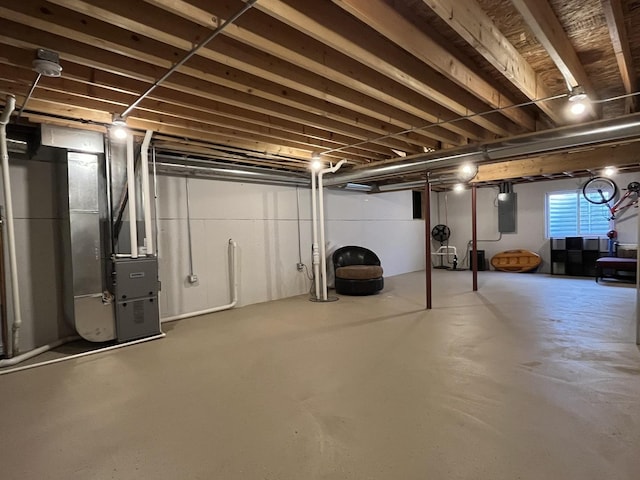 basement with heating unit and electric panel