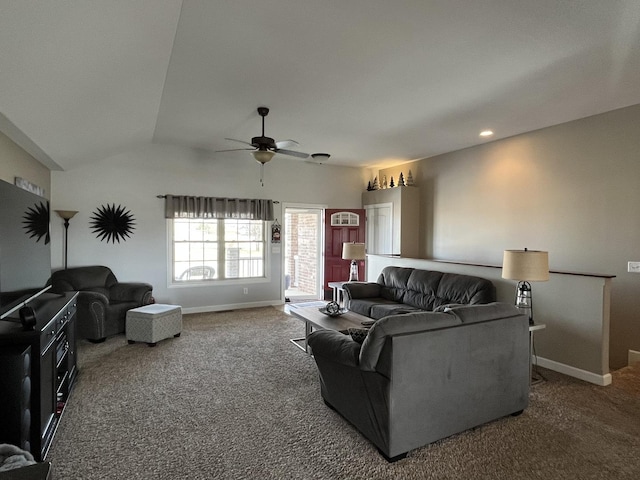 carpeted living room with vaulted ceiling and ceiling fan