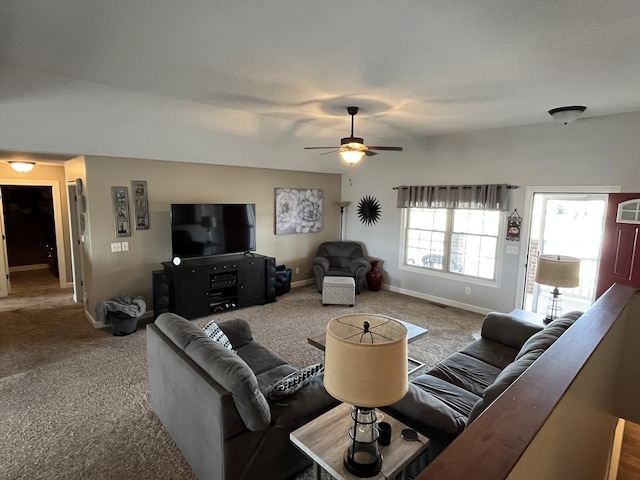 living room with ceiling fan and carpet flooring