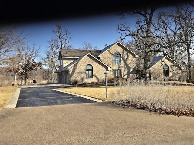 view of front of home with aphalt driveway