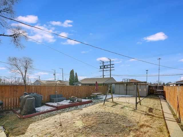 view of yard with a patio and a shed