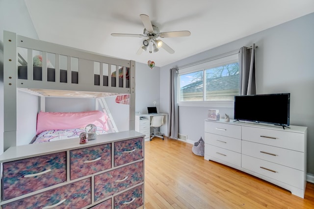 bedroom with ceiling fan and light hardwood / wood-style floors