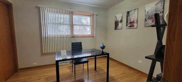 office space with light hardwood / wood-style floors