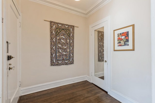 hall featuring crown molding and dark wood-type flooring