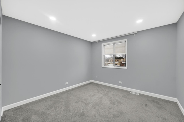 empty room with carpet flooring