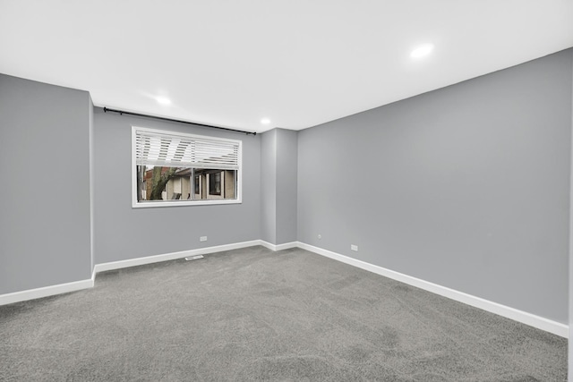 unfurnished room with carpet flooring