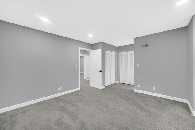 unfurnished room with light colored carpet