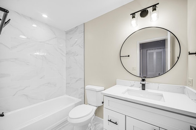 full bathroom with tiled shower / bath, vanity, and toilet