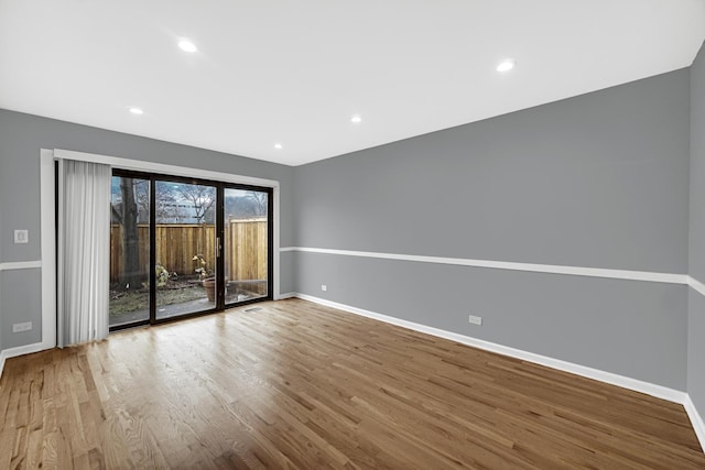 spare room featuring hardwood / wood-style flooring