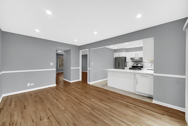 unfurnished living room featuring light hardwood / wood-style floors