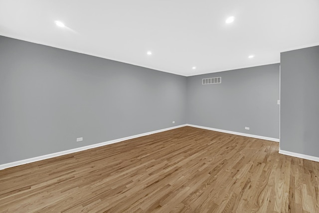 unfurnished room with light hardwood / wood-style floors