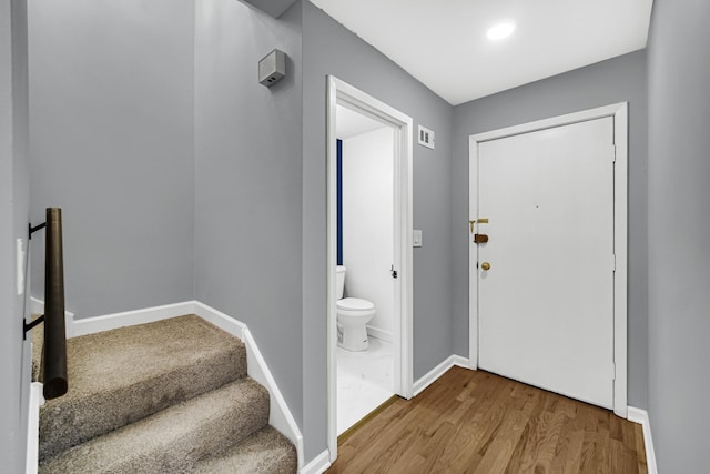 foyer entrance featuring wood-type flooring