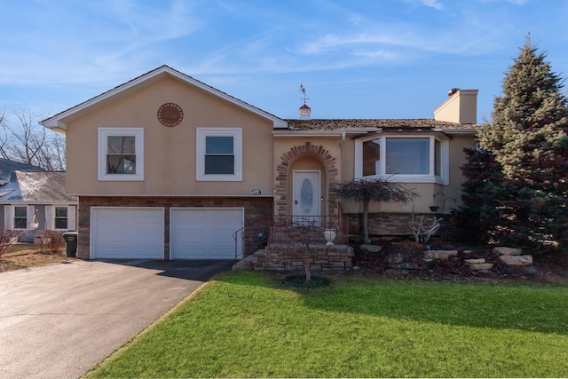 view of front of home featuring a garage and a front yard