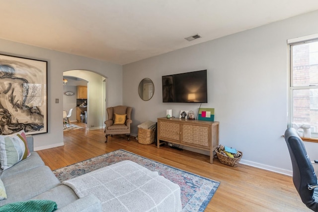 living room with light hardwood / wood-style floors