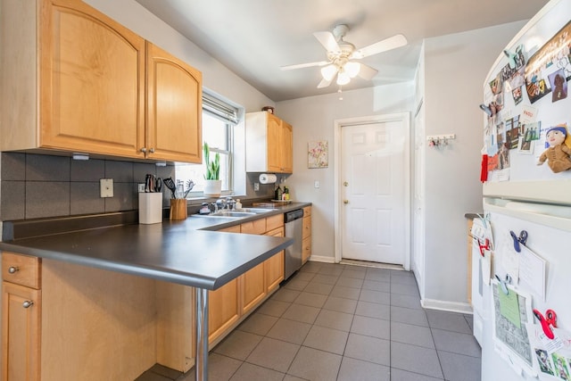 kitchen featuring sink, white refrigerator, dishwasher, dark tile patterned flooring, and ceiling fan