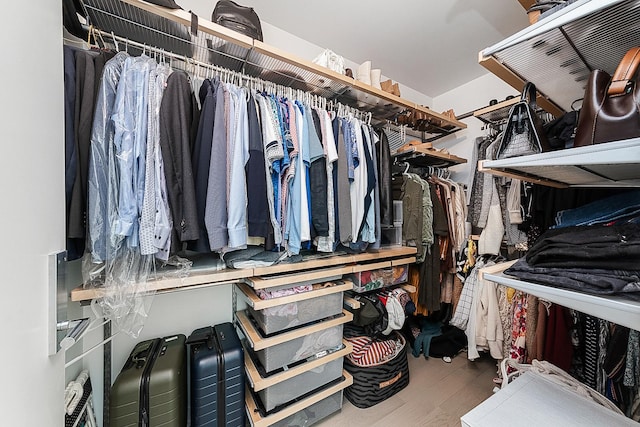 spacious closet with wood finished floors