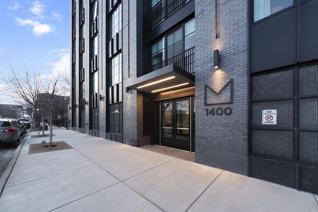 property entrance with brick siding