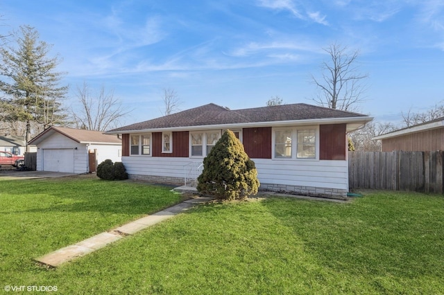 single story home with a garage, an outdoor structure, and a front yard