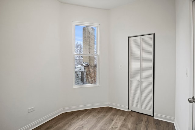 unfurnished bedroom featuring hardwood / wood-style floors