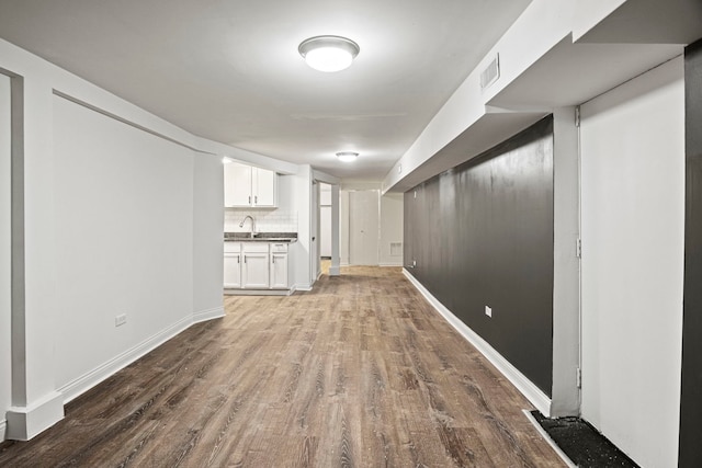 interior space featuring hardwood / wood-style flooring and sink