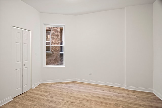 empty room with light wood-type flooring